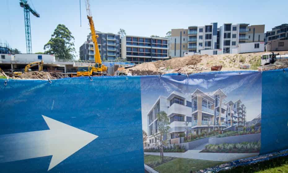Property Inspections As Chinese Homebuyers Thronging Sydney Create Mini-Bubble Frenzy
An artist’s impression of a residential development is displayed outside a construction site in the suburb of Eastwood in Sydney, Australia, on Saturday, Jan. 11, 2014.