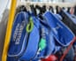 A blue gym kit bag with Gymnastic Academy written on it.
