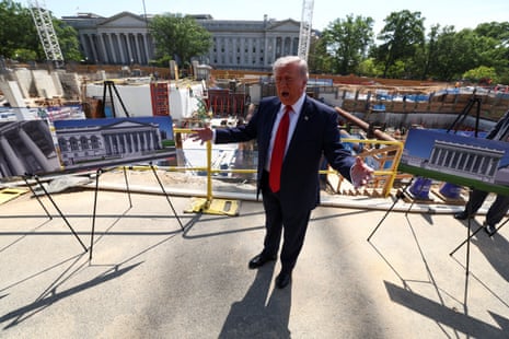 a man speaks next to a construction site