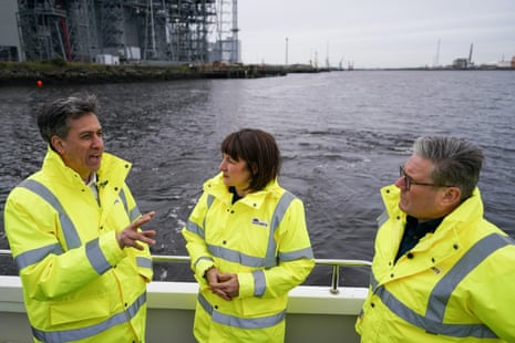Left tor right: Ed Miliband, shadow energy secretary, Rachel Reeves, shadow chancellor, and Keir Starmer on a boat on the he River Tees during a visit to PD ports in Teesside this morning.