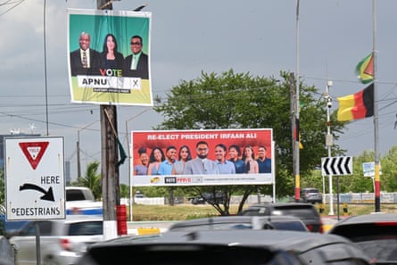 Election campaign billboards along a road.