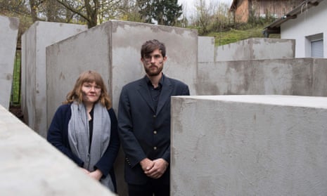 Members of the art collective Centre for Political Beauty pose inside the replica of Berlin’s Holocaust memorial.