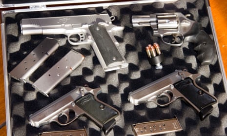 Handguns, magazines and speedloader displayed in a case.