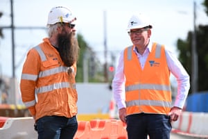 Victorian premier Daniel Andrews (right) during an election-day visit to the Glen Huntly level crossing removal site