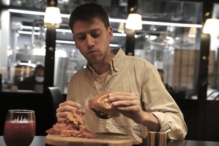 Oliver Holmes tries the burger at the Chicken.