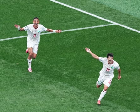 Soufiane Rahimi of Morocco celebrates with Brahim Diaz after scoring the team’s third goal against Canada, 4 July.