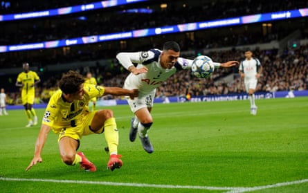Pedro Porro of Tottenham in the thick of the action.