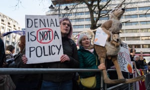 Protesters with signs at climate protest