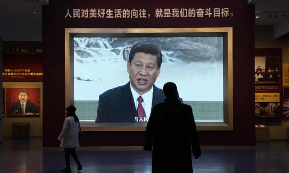 Xi Jinping on a TV screen under the slogan "The people's yearning for a better life is the goal we strive for" at the Museum of the Communist Party of China  in Beijing.