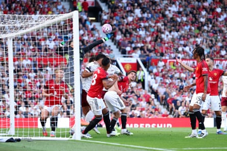 Manchester United goalkeeper Altay Bayindir flaps astatine an inswinging corner, palming nan shot connected for Riccardio Calafiori to people Arsenal’s winner.