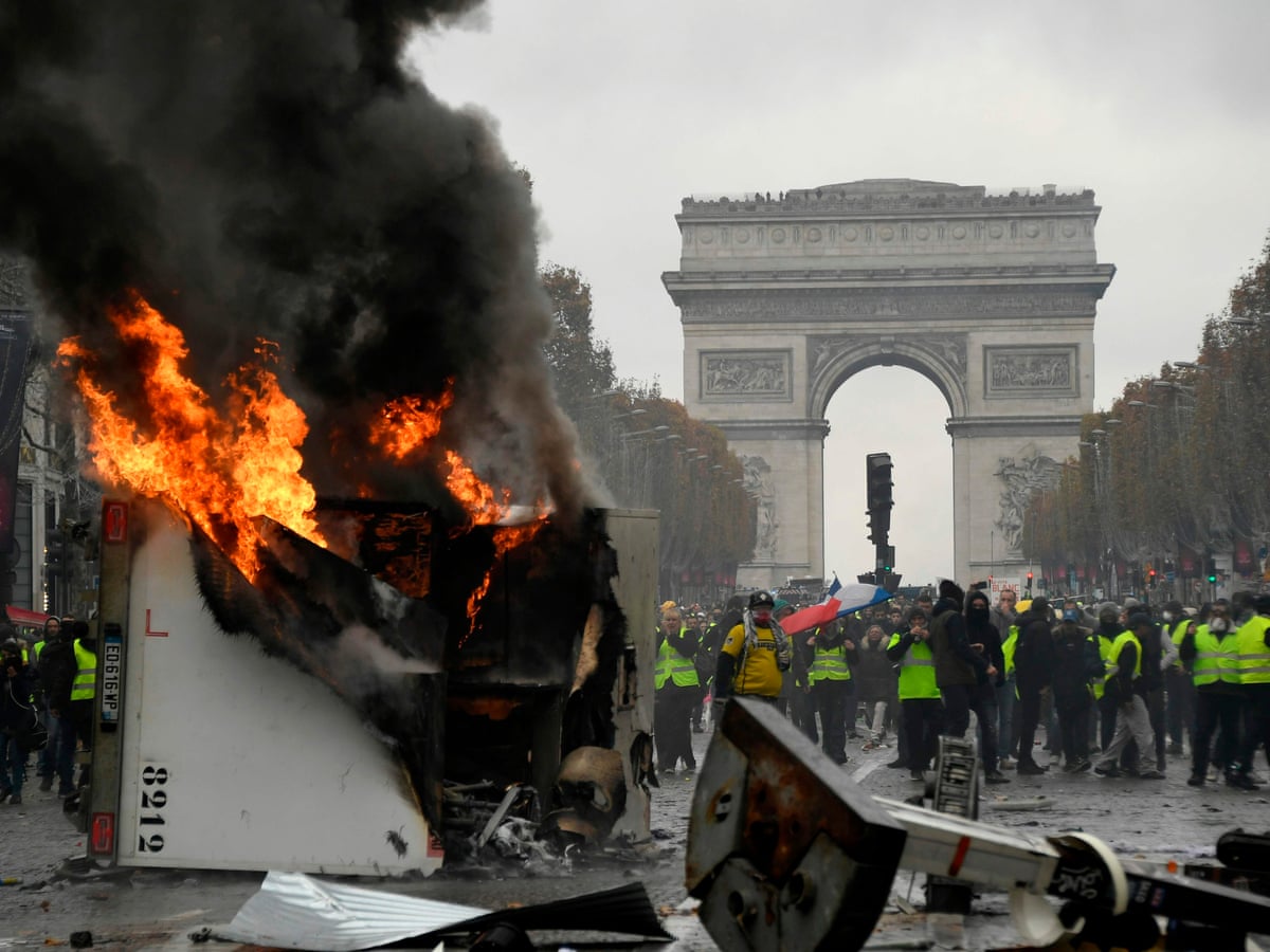 French 'gilets jaunes' protests turn violent on the streets of Paris | Paris | The Guardian