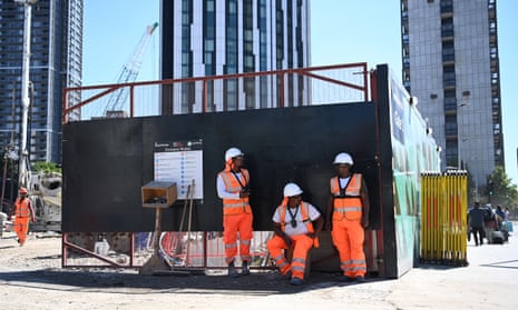 Construction workers shelter in the shade at building site in London in August.