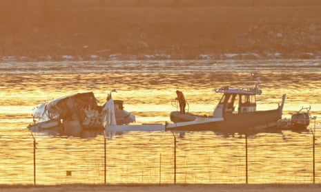 Rescue workers search wreckage in river