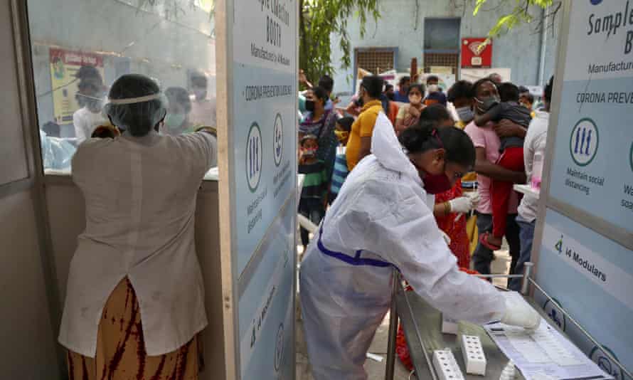 People queue to get tested for Covid-19 in Hyderabad, India,