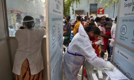 People queue to get tested for Covid-19 in Hyderabad, India,