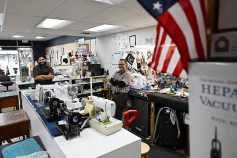 two men in a crowded shop