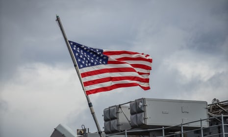 A US flag on a navy amphibious assault ship