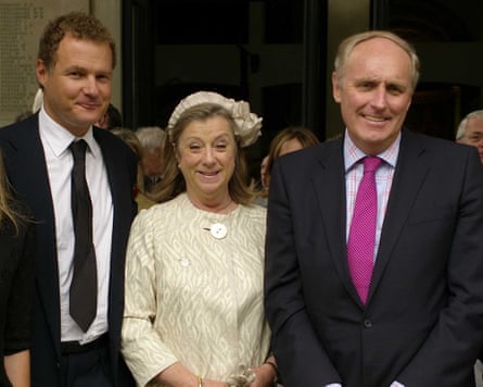 Rothermere and Dacre posing for a picture at a memorial service, with a female attendee in between