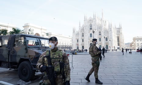 Italian soldiers wearing masks in Duomo Square in Milan.