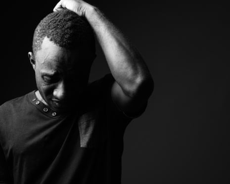 Sad young African man thinking and looking depressed