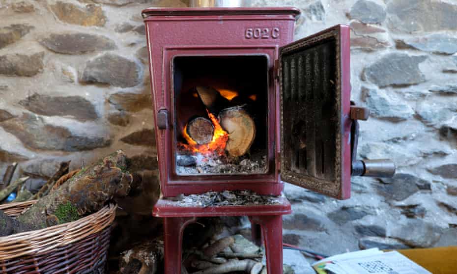 A woodburning stove with door open