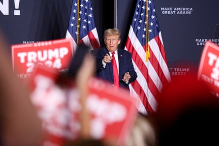 Donald Trump points at the supporters after speaking during the rally in Dubuque.