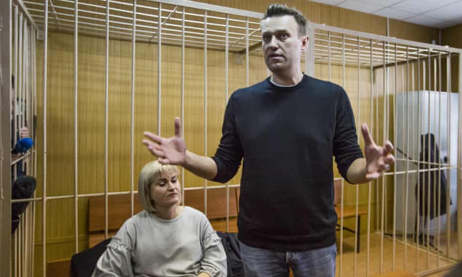 Russian opposition leader Alexei Navalny and his lawyer Olga Mikhailova in court in Moscow on Monday.