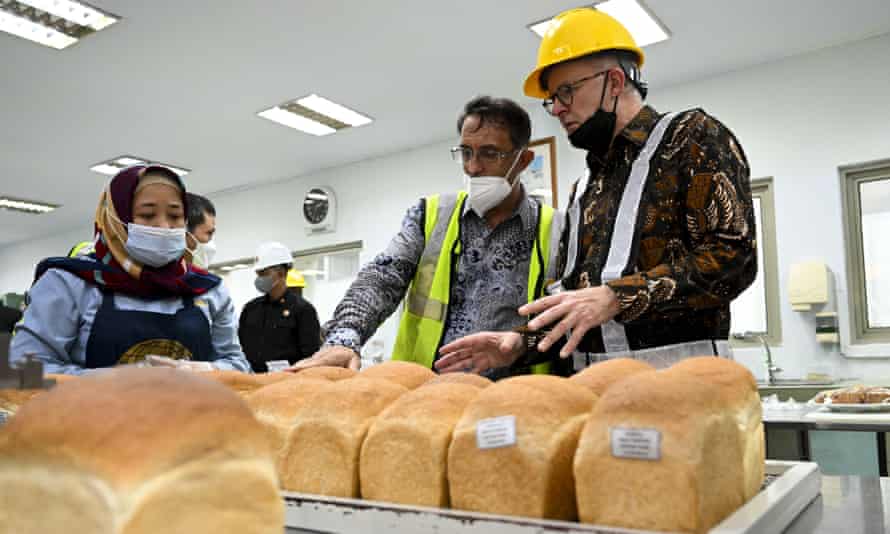 Australian prime minister Anthony Albanese is shown freshly baked bread during a visit to Eastern Pearl Flour Mill in Makassar, Indonesia