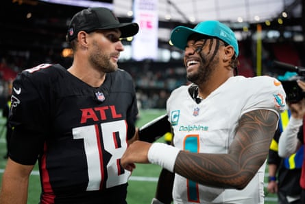 Tua Tagovailoa talks with his opposite number, Kirk Cousins, after Sunday’s game.