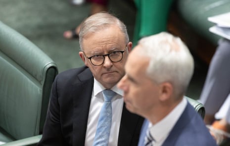 Anthony Albanese watches Andrew Giles during a condolence motion for the late Senator Linda White.