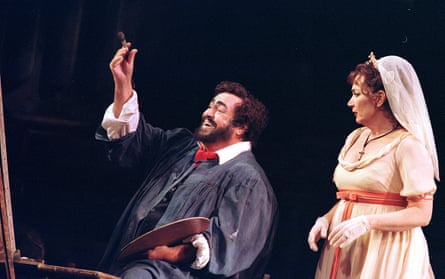 Luciano Pavarotti painting a picture at an easel as Carol Vaness looks on