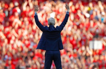 Arsène Wenger waves goodbye to the crowd following his final home match as Arsenal manager in 2018.