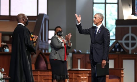 Barack Obama gestures after speaking during the funeral of the late congressman John Lewis in Atlanta, Georgia, on 30 July.