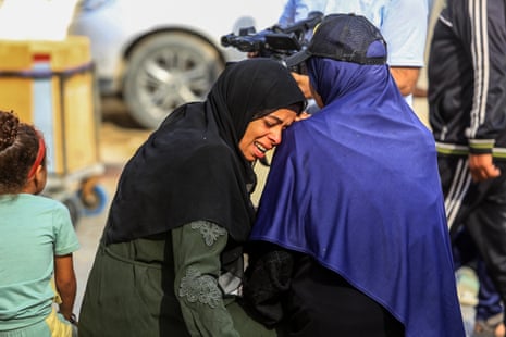 Relatives and loved ones mourn Palestinians killed by Israeli fire near an aid distribution centre on Tuesday morning.