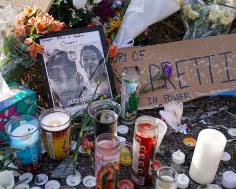 Flowers, candles and photographs left at a makeshift memorial for Alex Pretti and Renee Good.