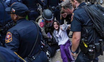 Student protesters are pushed to the edge of campus at the University of Texas, on Wednesday, 24 April 2024, in Austin, Texas.