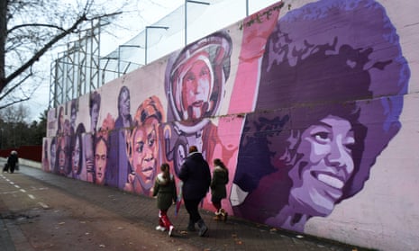A feminist mural in Madrid featuring images of Frida Kahlo, Nina Simone and Rosa Parks.