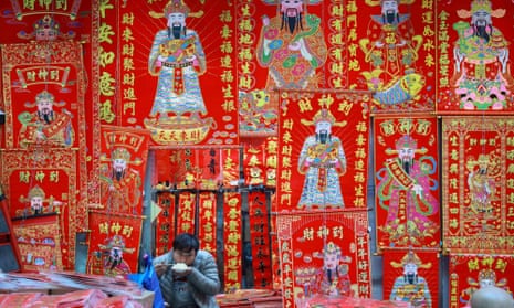 A vendor waits for customers at his market stall in Shenyang in China’s north-eastern Liaoning province. 