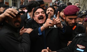 Islamabad, Pakistan Police officials escort Pakistan’s erstwhile interior curate Sheikh Rashid Ahmed earlier a court