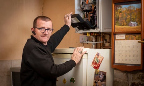 James Anderson fixing a boiler.