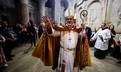 Worshippers attend Easter Sunday mass in the Church of the Holy Sepulchre in Jerusalem's Old City on 9 April