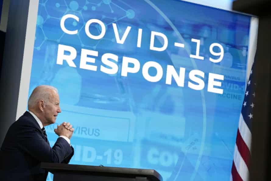 biden in front of screen saying 'covid-19 response'