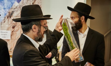 Hasidic Jewish men inspecting produce