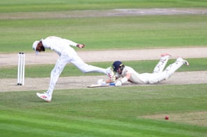 Pope dives to make his ground.