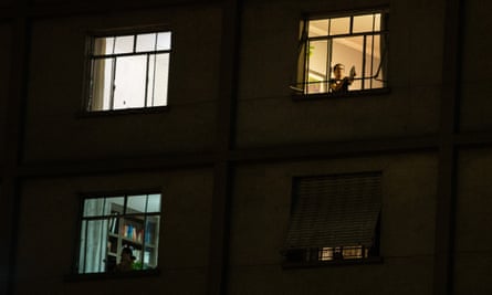Protesters stand on their windows making noise with pots and pans (Panelaco) against President of Brazil Jair Bolsonaro