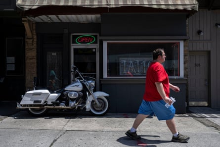 Man walks past shop