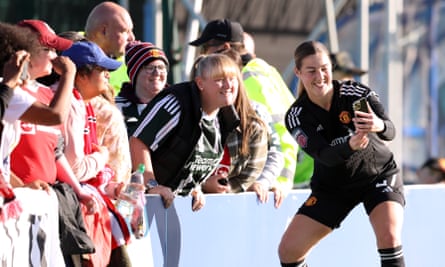 Mary Earps takes a selfie for supporters after Manchester United’s 5-0 win over Everton