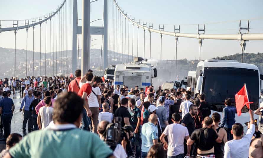 People gather on Istanbul’s Bosphorus Bridge on Saturday following Friday night’s failed coup attempt.