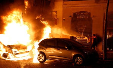 parked car being devoured by flames