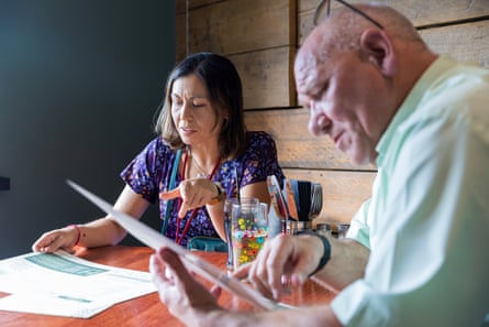 Sunyi and Francis sitting at a restaurant table looking at menus